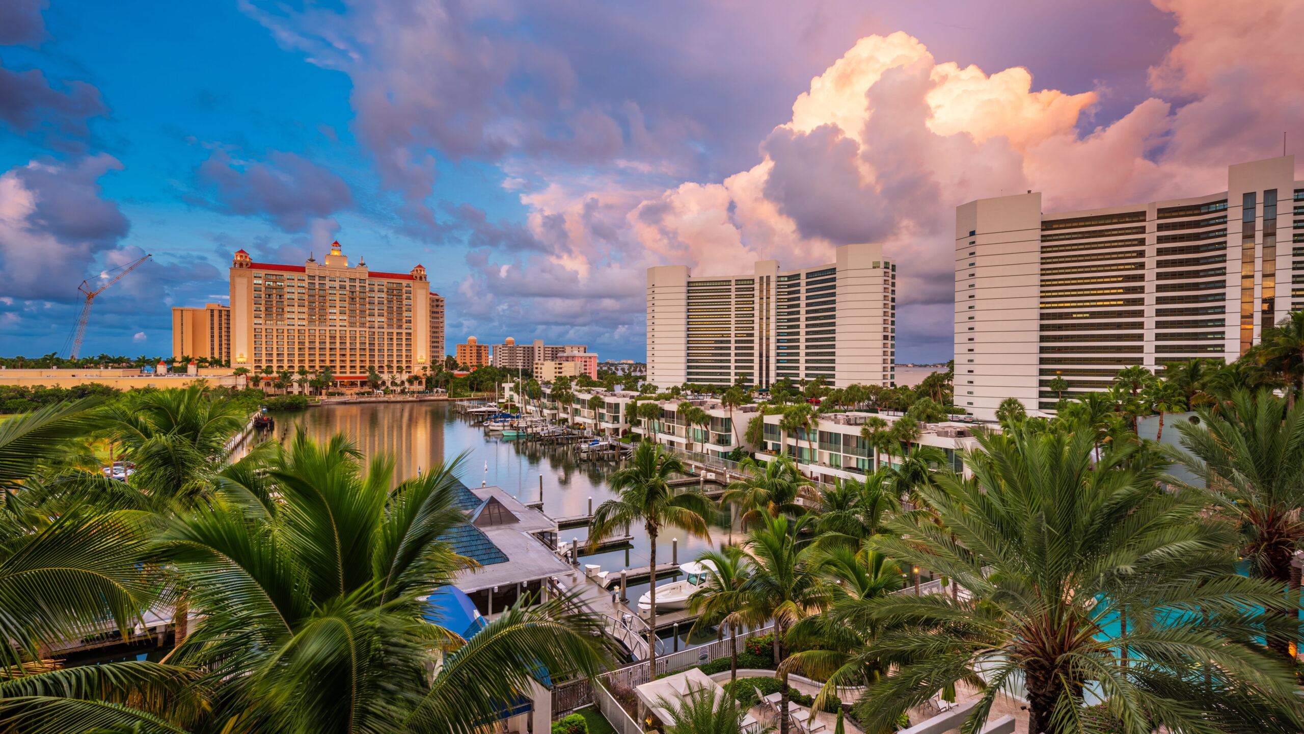 Sarasota Florida marina skyline at sunset with views of the water and condos.